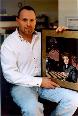 Artist Michael holding his "Gaslight" painting and link to his website.